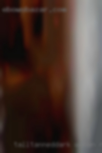 Tall,tanned,dark woman naked ,tattoos.